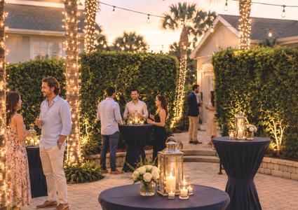 First Bites First Splash — open-air courtyard at 200 First Street, illuminated palms and string lights